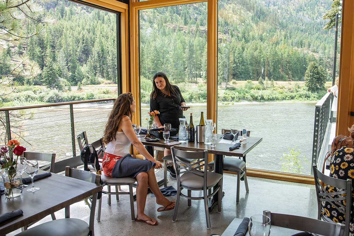 Ladies Dining On The Glass Pavilion Overlooking The River
